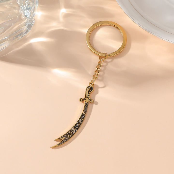 HilalHaven Warrior’s Verse Engraved Zulfiqar Keychain  - Curved Sword - Gold - image 2