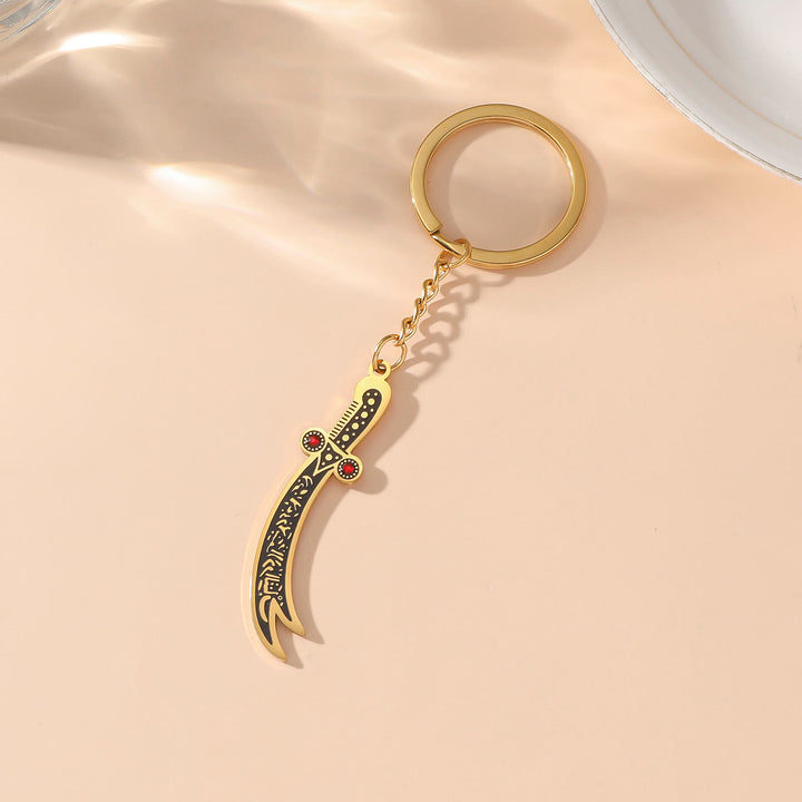 HilalHaven Warrior’s Verse Engraved Zulfiqar Keychain  - Zulfiqar Sword - Golden - image 0