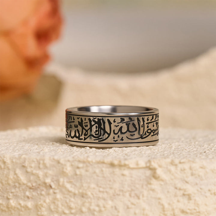 HilalHaven Devotion Shahada Engraved Spinner Ring — Polished Titanium Steel - Silver Ring with Black Lettering - US11 - image 0