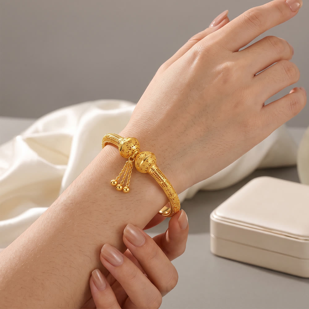 HilalHaven Filigree Sphere Tassel Bangle‑Gold‑Plated Copper Hollow‑Bead Cuff Bracelet - image 0