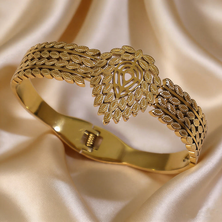 HilalHaven Vintage Foliage Stainless Steel Hollow Leaf Rhinestone Spring Bangle - image 1